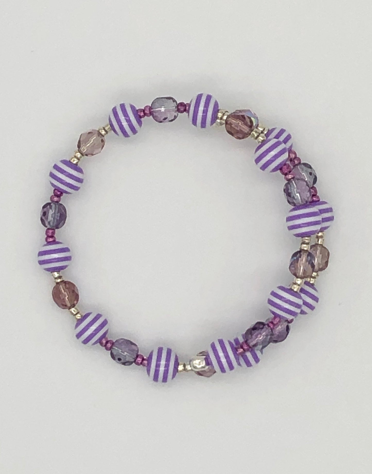 Purple faceted and purple with white stripes memory wire bracelet