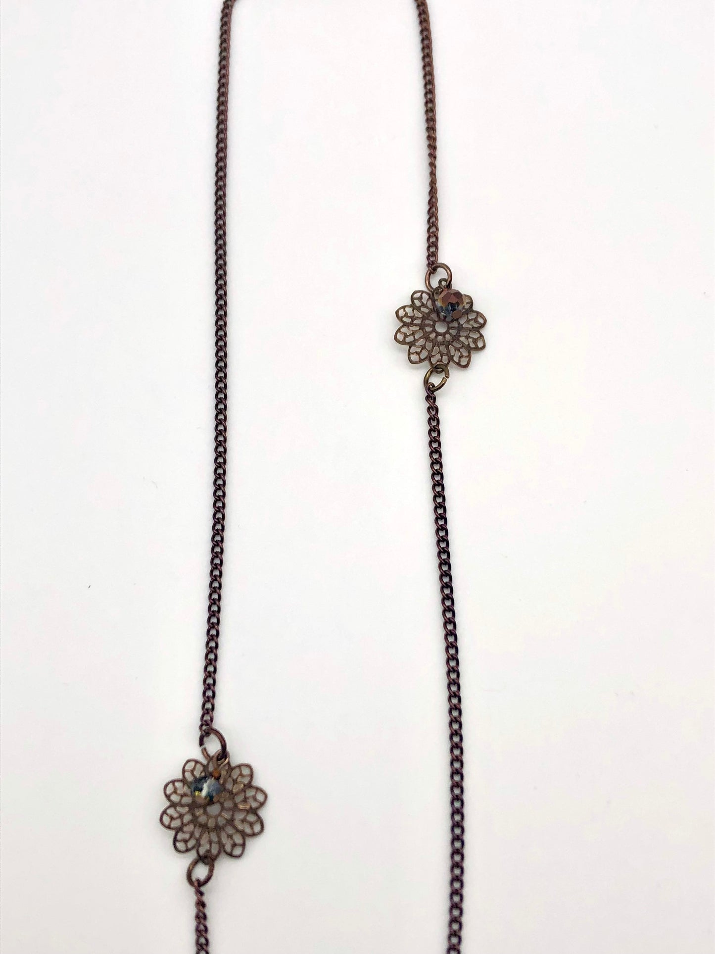 Chocolate curb chain with filigree flower bead necklace