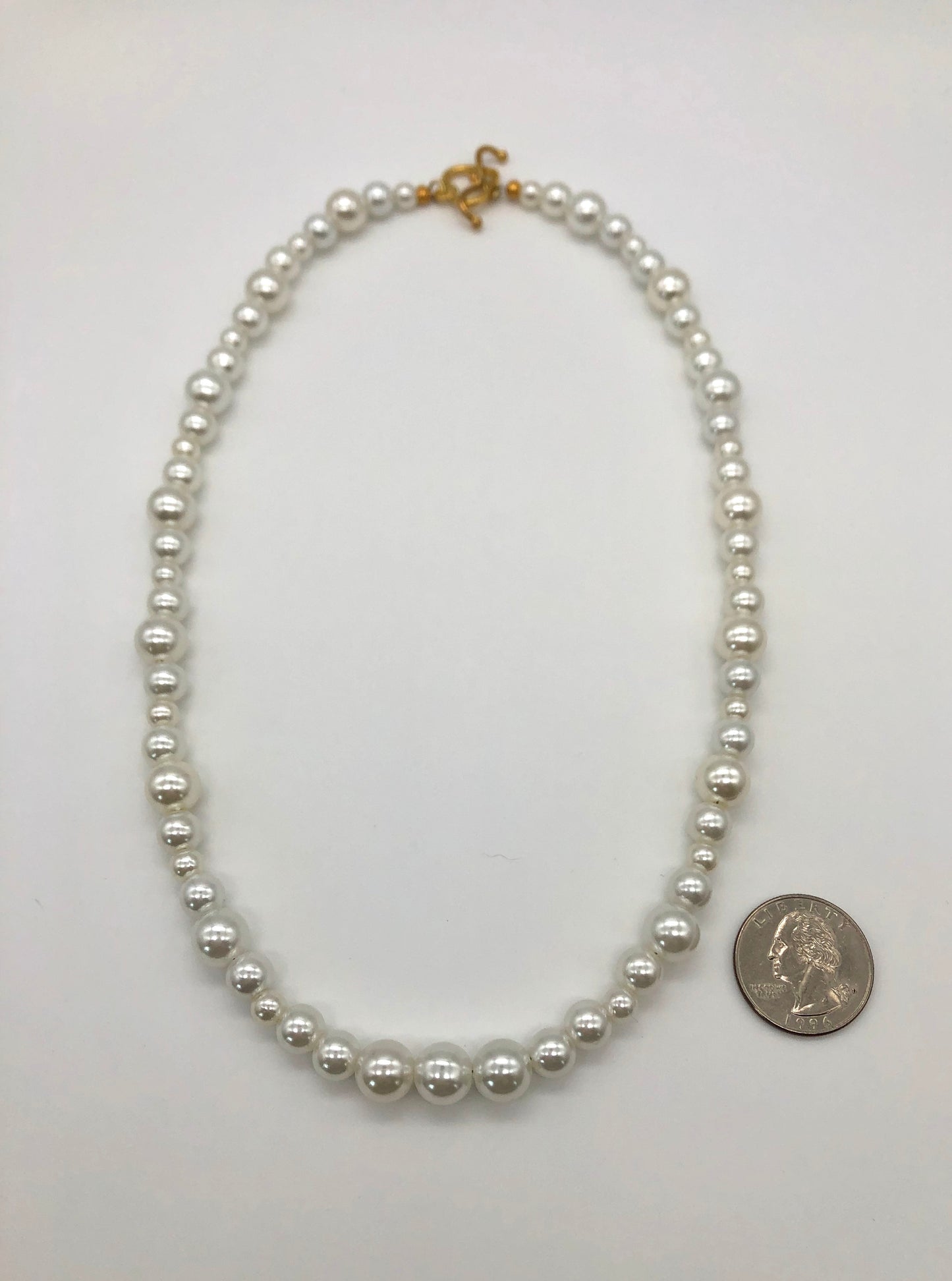 Faux pearl bead necklace with gold plated heart toggle clasp