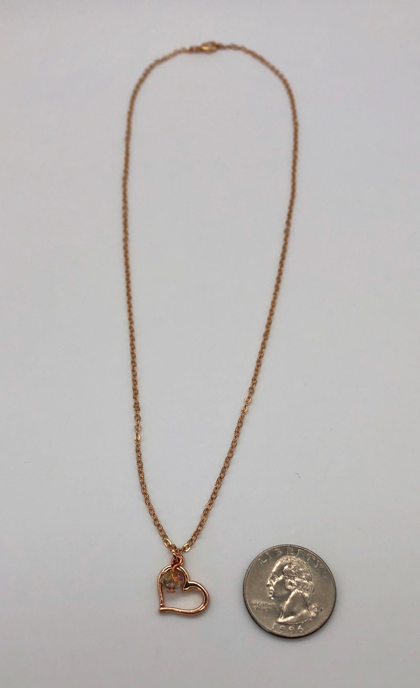 Rose gold plated chain with open heart charm and bead accent necklace