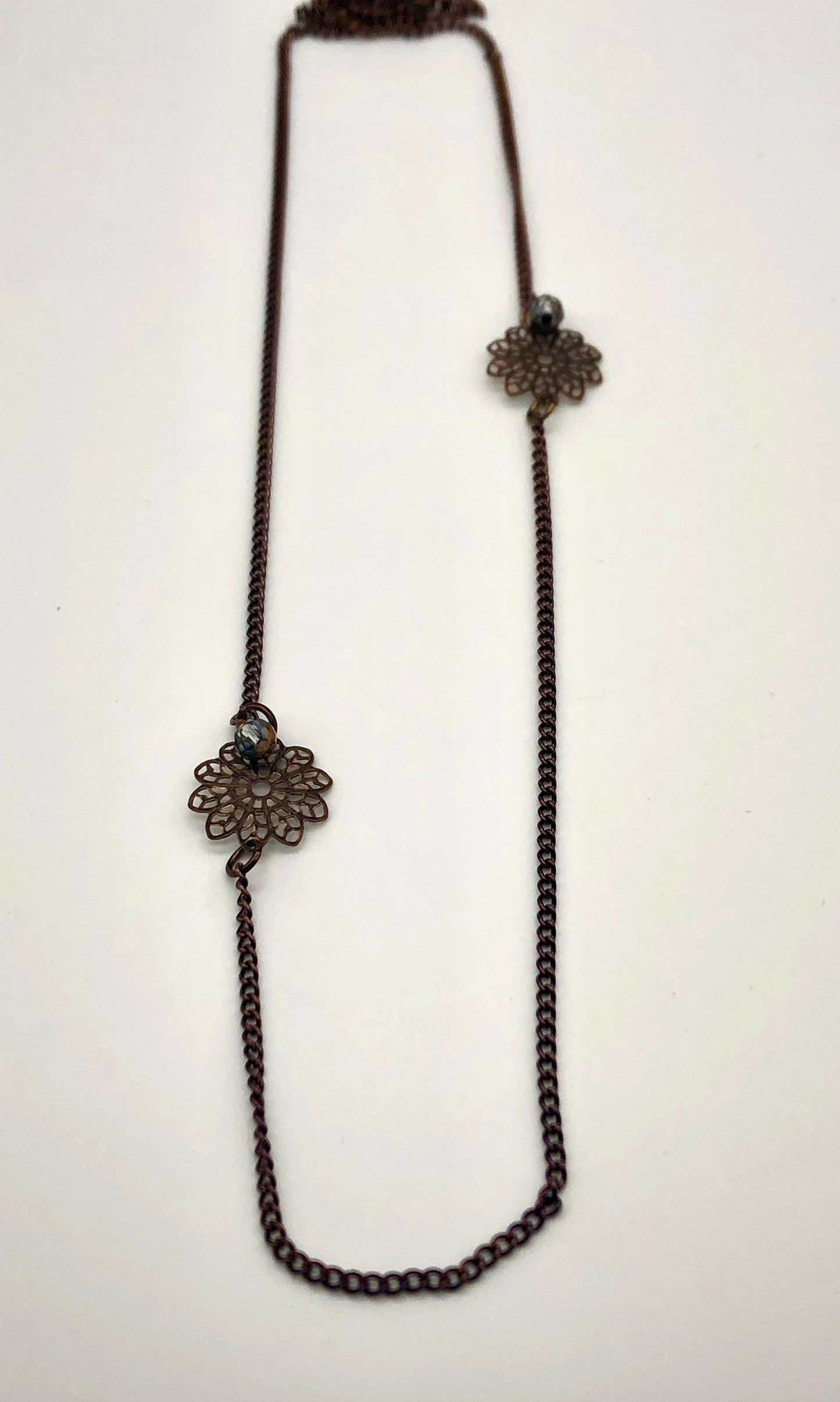 Chocolate curb chain with filigree flower bead necklace