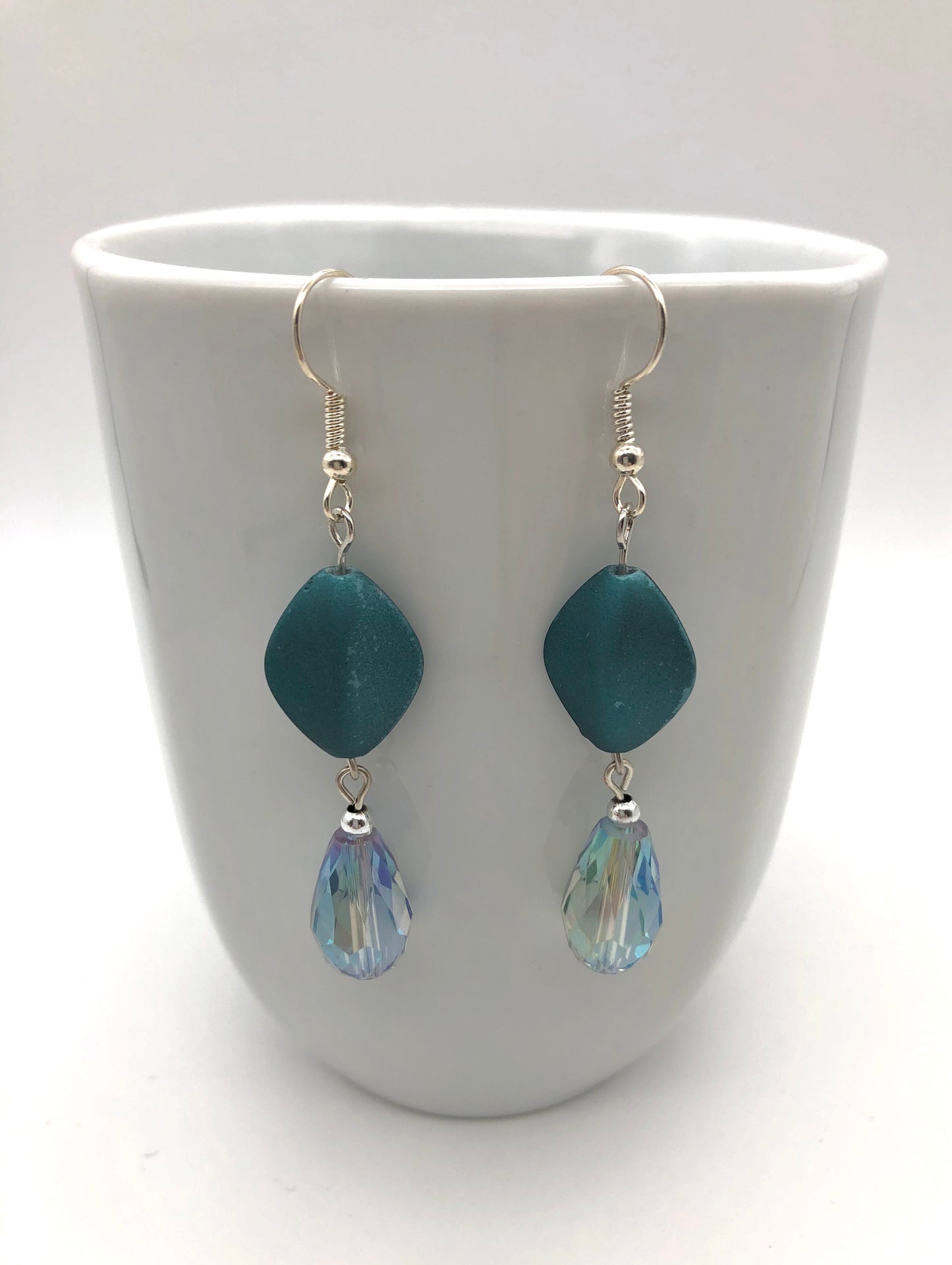 Teal matte oval bead and iris blue teardrop bead earrings