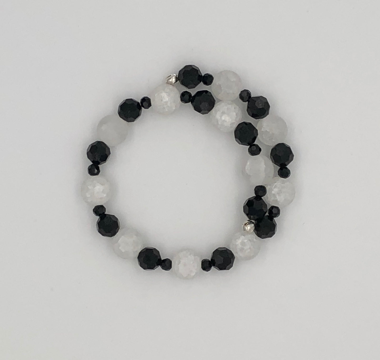 Black faceted bead and white crackle bead memory wire bracelet