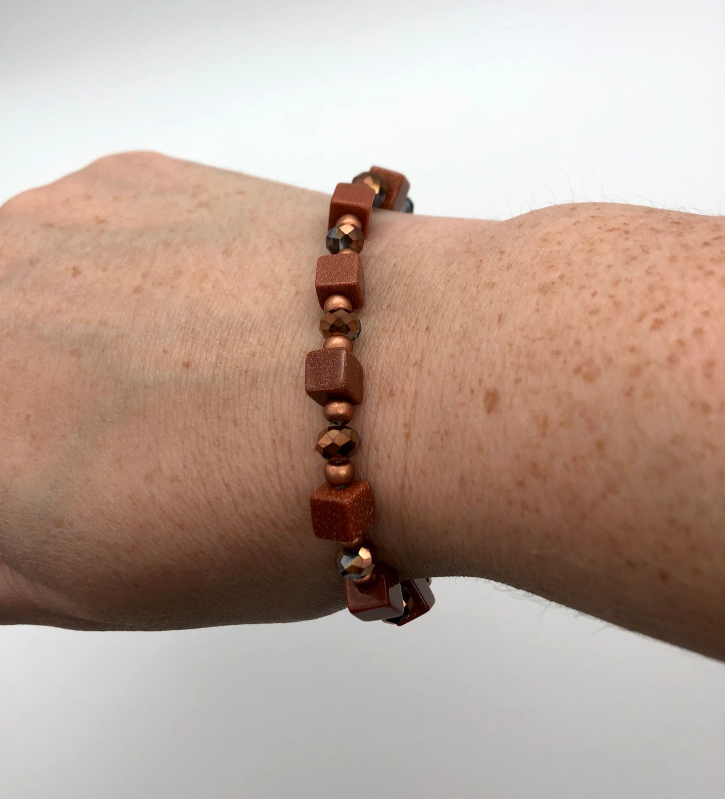 Goldstone and amber bead stretch bracelet