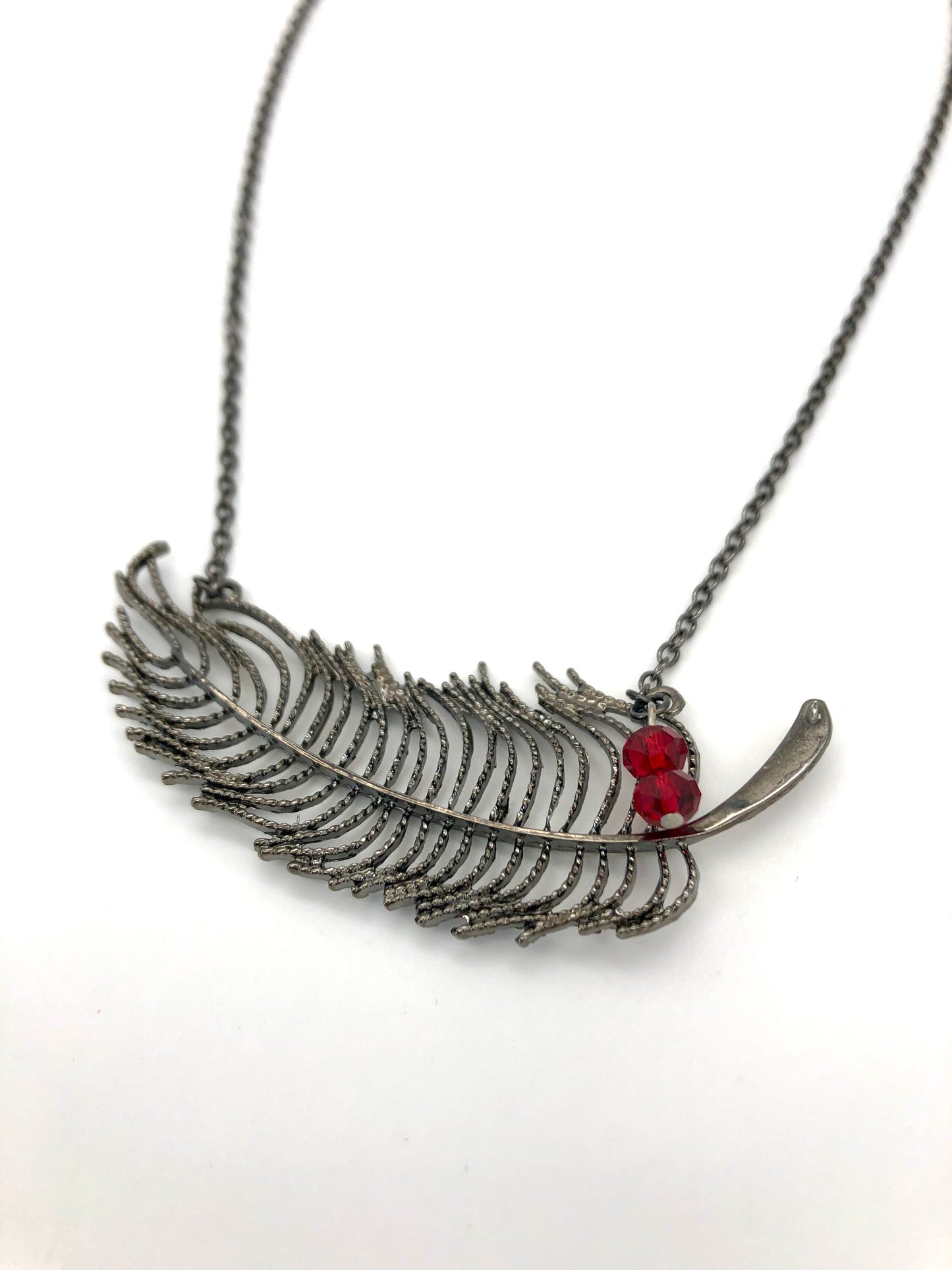 Feather necklace with red bead accents