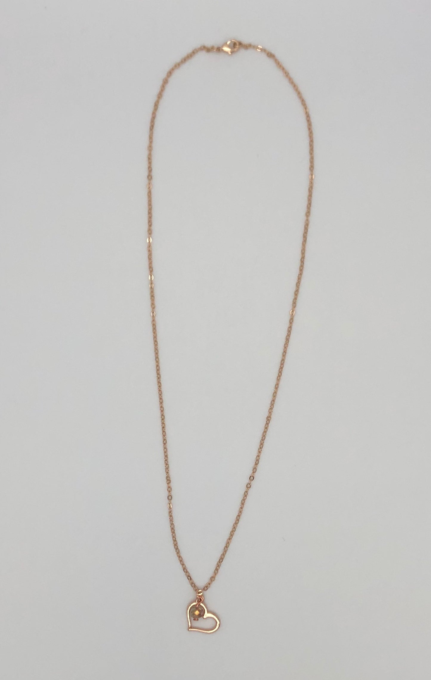 Rose gold plated chain with open heart charm and bead accent necklace