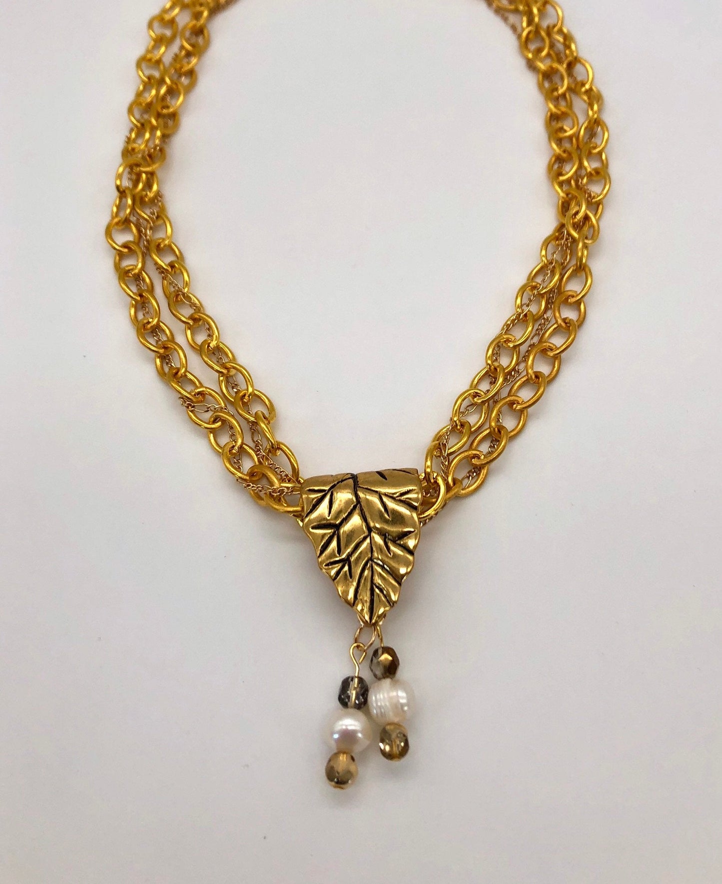 Gold plated large chain with leaf bail and freshwater pearl glass bead detail necklace