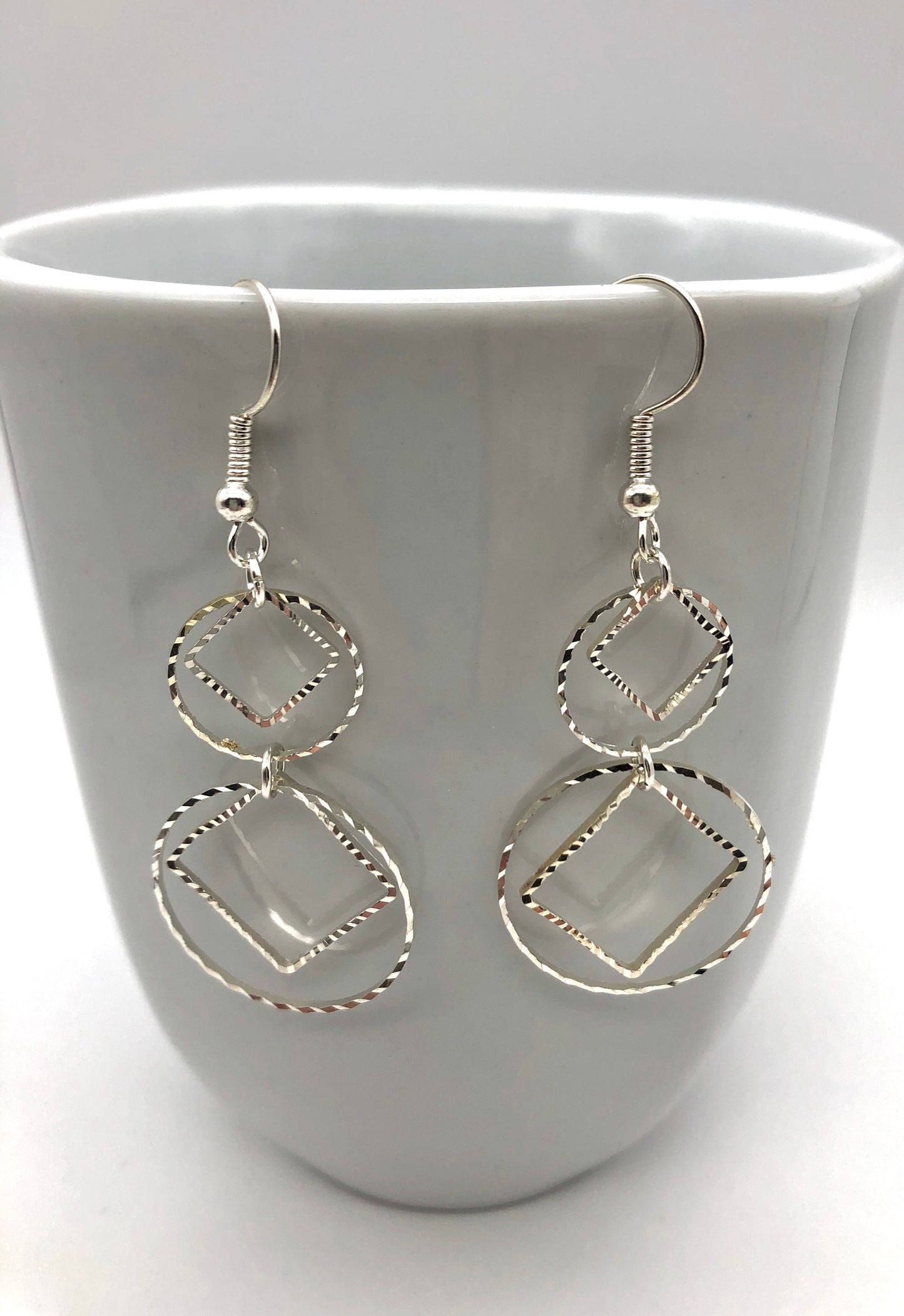Diamond and circle cutouts drop earrings