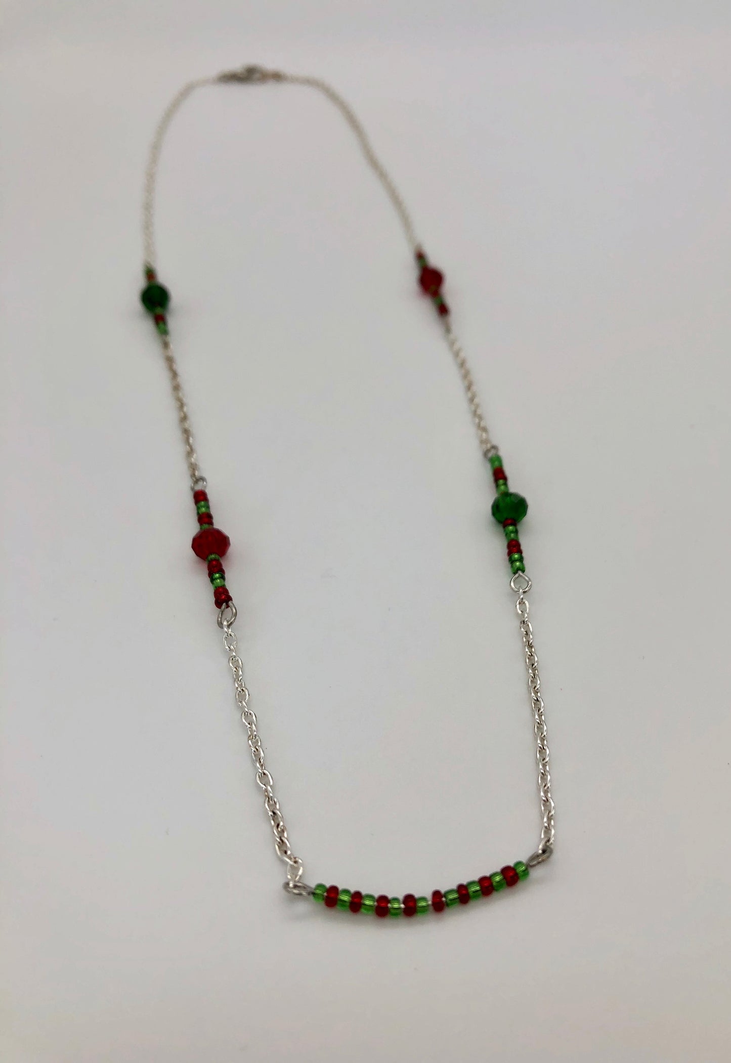 Silver cable chain with red and green seed bead accent necklace