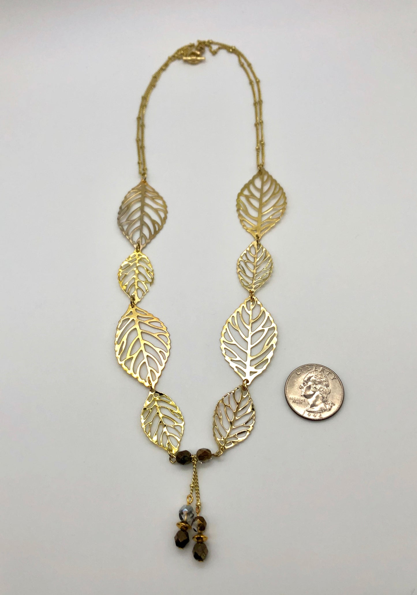 Gold leaf with dangle and double gold ball chain necklace