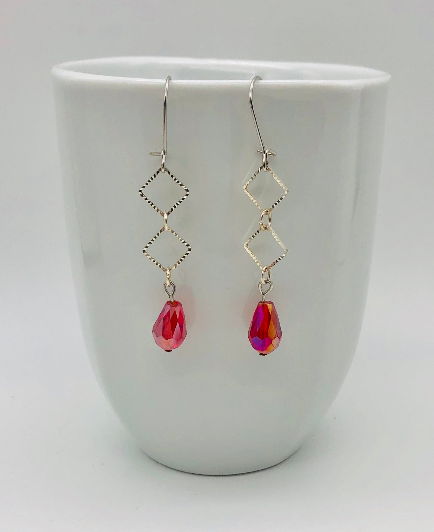 Fuschia beads with diamond cutout shaped earrings