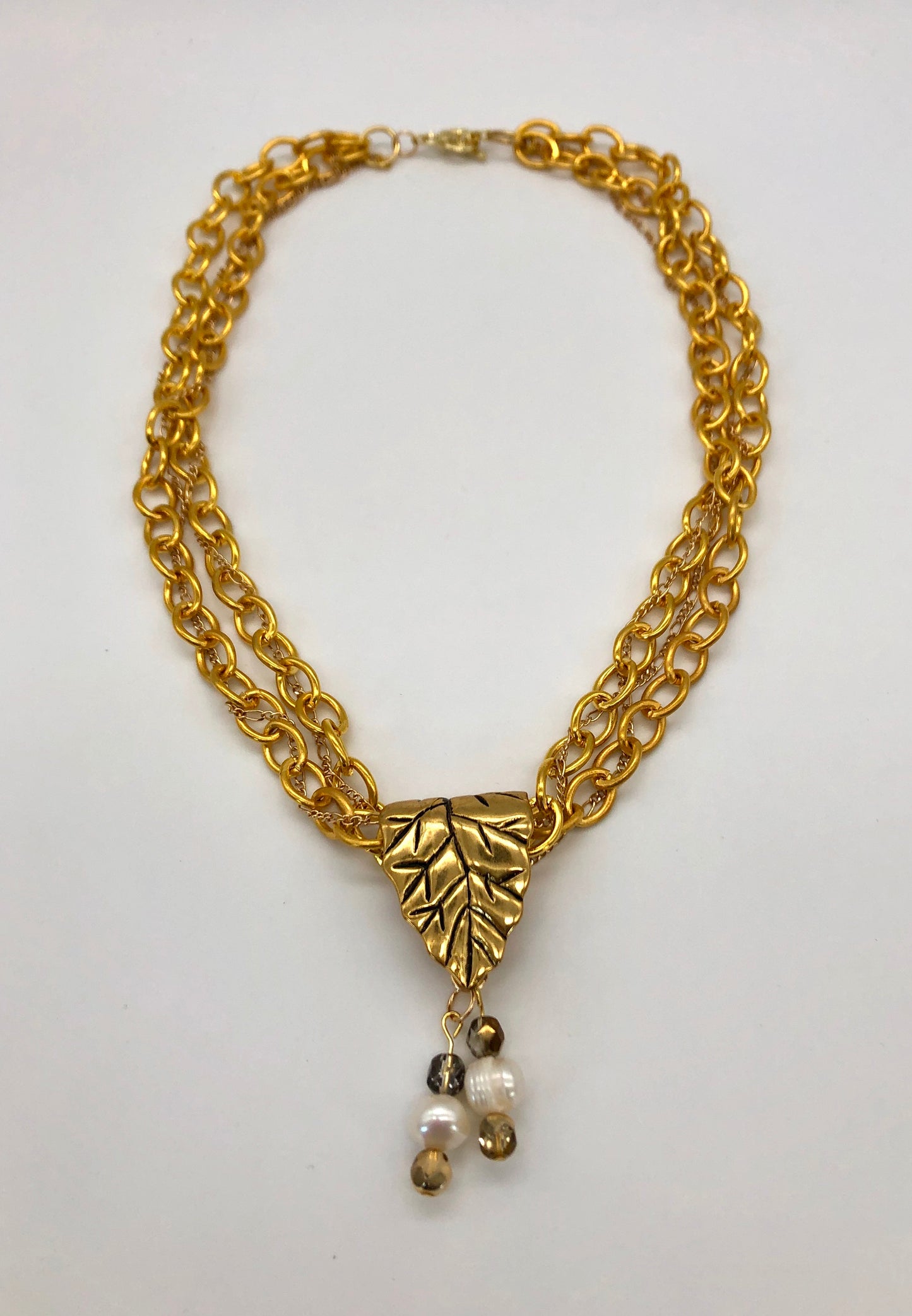 Gold plated large chain with leaf bail and freshwater pearl glass bead detail necklace