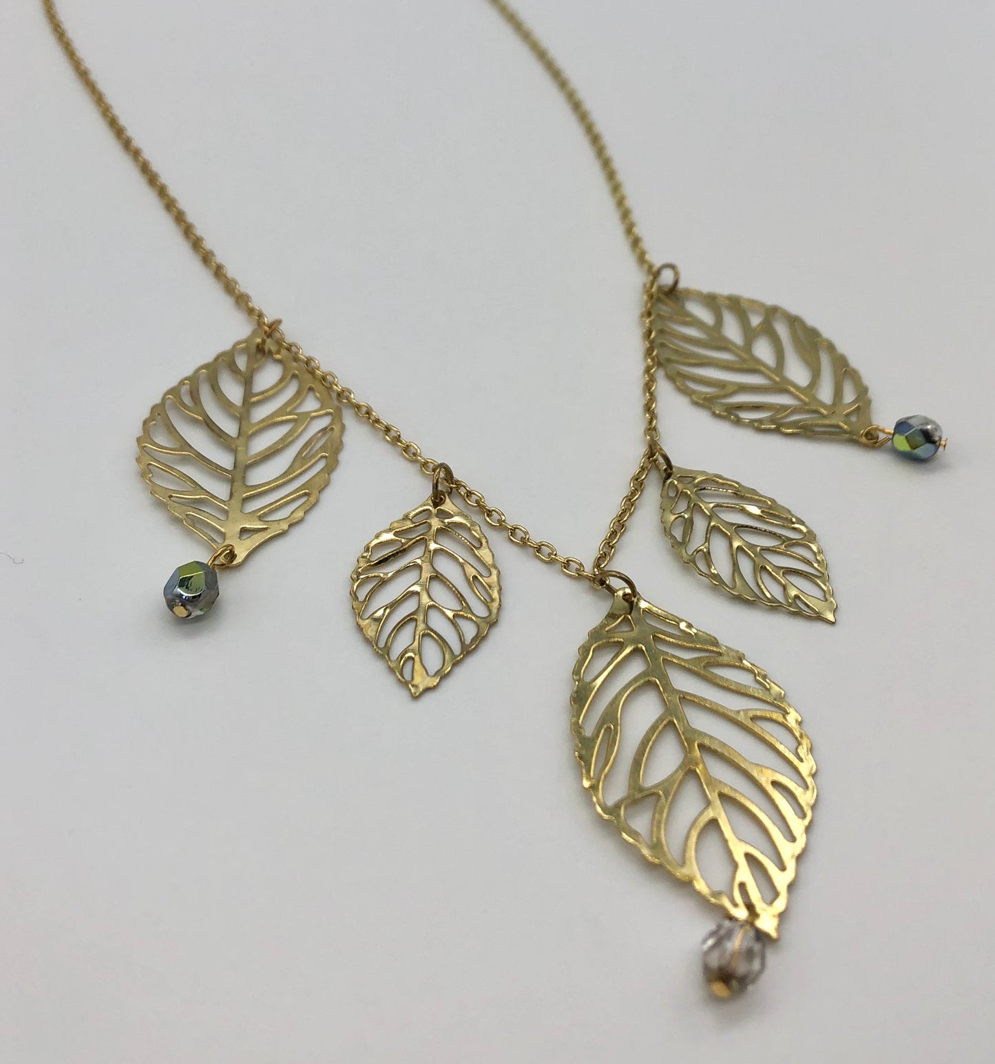Gold plated leaf cutout dangles chain necklace