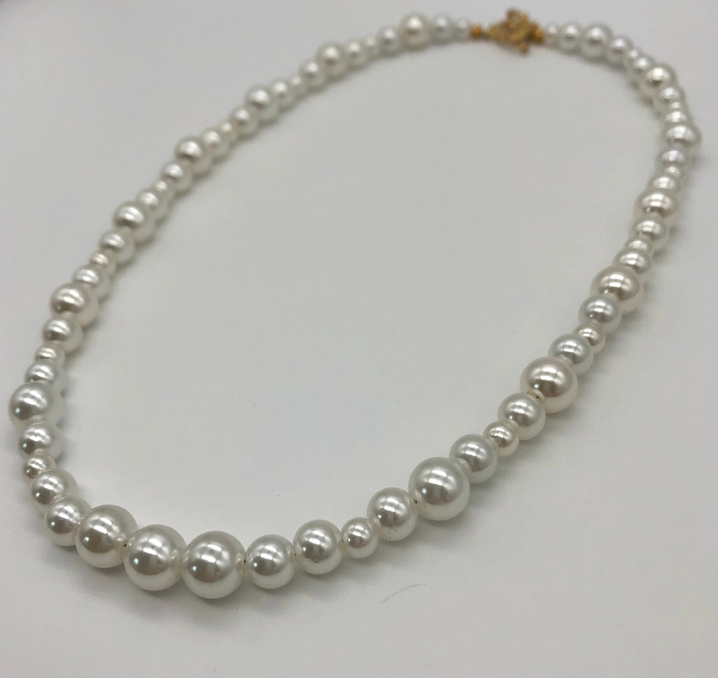 Faux pearl bead necklace with gold plated heart toggle clasp