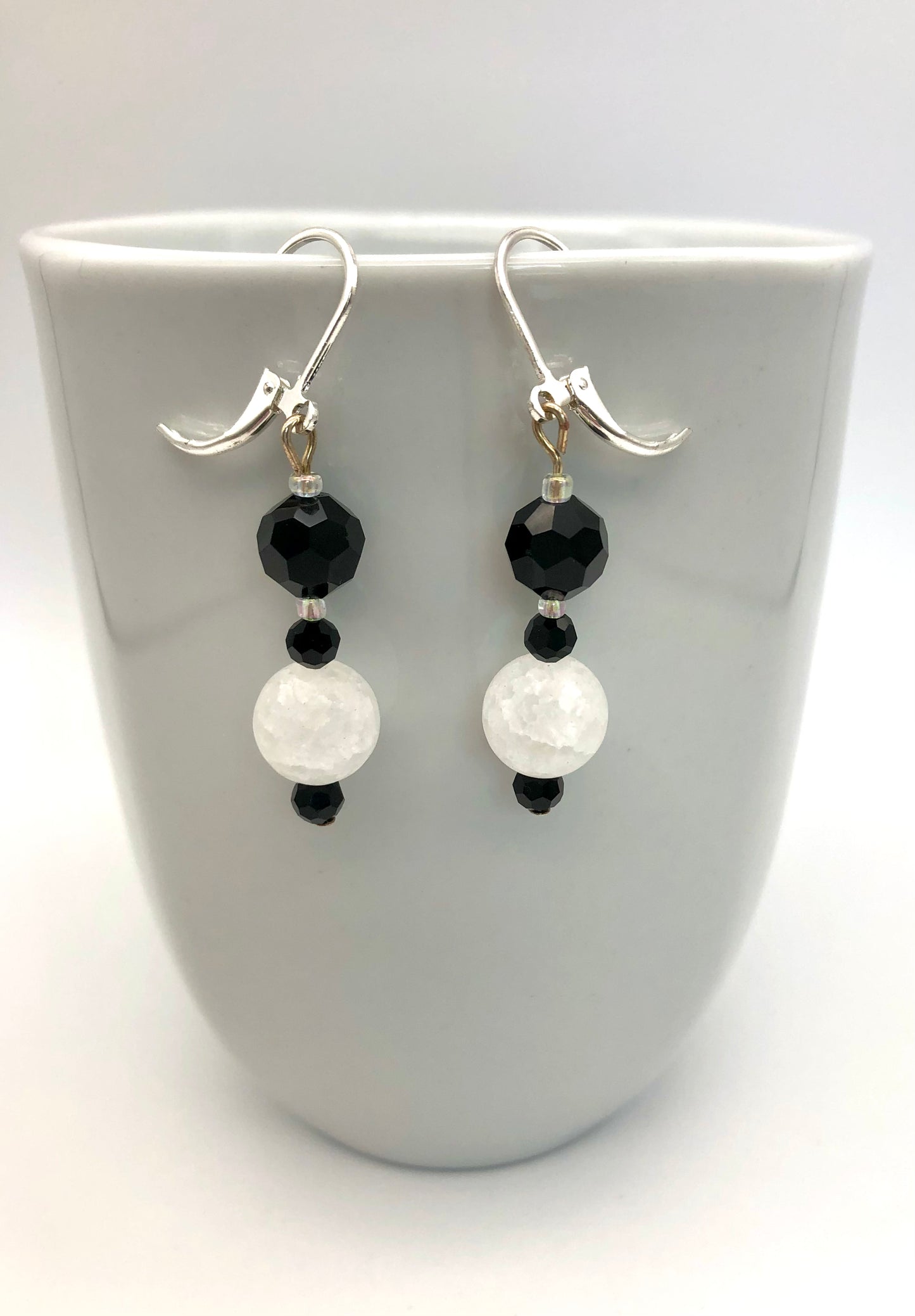 Black faceted and white crackle bead earrings